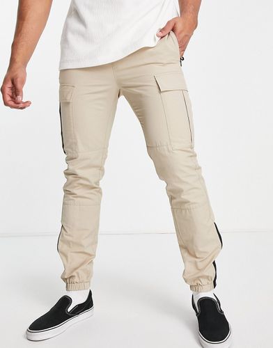 Pantaloni cargo skinny color pietra cut and sew - Topman - Modalova
