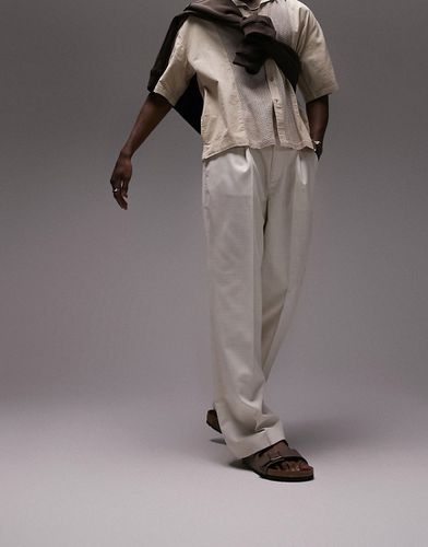 Pantaloni con fondo ampio in misto lino color pietra - Topman - Modalova