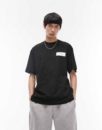 T-shirt oversize nera con stampa "Paris" sul davanti e sul retro - Topman - Modalova