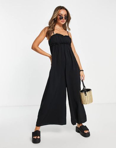 Tuta jumpsuit nera raccolta in vita con volant - Topshop - Modalova