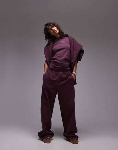 Joggers dritti bordeaux con stampa "Community" in coordinato - Topshop - Modalova