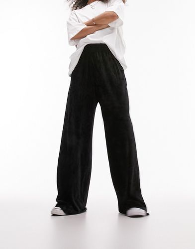 Pantaloni a fondo ampio in velluto plissé - Topshop - Modalova