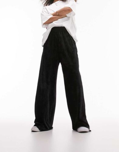 Pantaloni a fondo ampio in velluto plissé - Topshop - Modalova