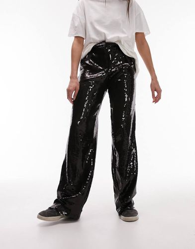 Pantaloni a fondo ampio neri a vita bassa con paillettes - Topshop - Modalova