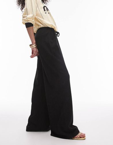 Pantaloni dritti oversize stropicciati neri con coulisse - Topshop - Modalova