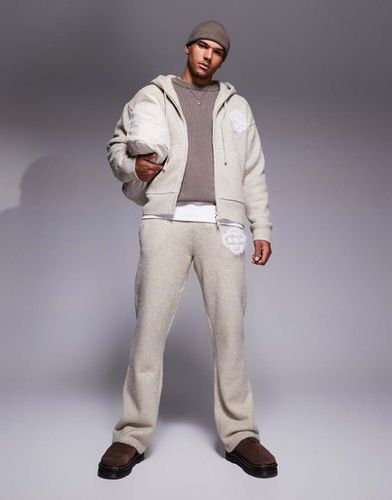 Joggers in maglia soffice beige con emblema in coordinato - The Couture Club - Modalova