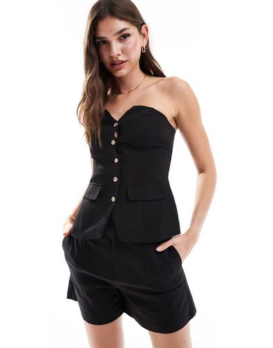 Top strutturato a corsetto con bottoni dorati - Urban Threads - Modalova