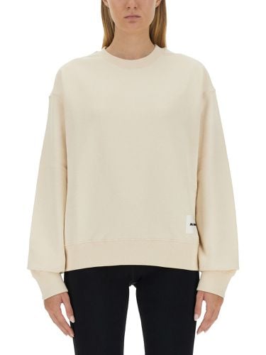 Sweatshirt with logo patch - jil sander - Modalova