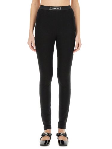 Versace leggings with logo - versace - Modalova