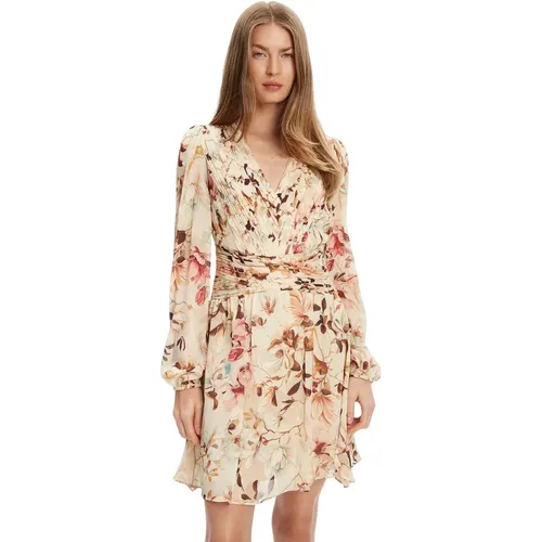 Il vestito plissato a maniche lunghe donna Guess Romina è un must-have del guardaroba femminile moderno, che unisce eleganza e comfort con una finezz - MAG10408332 - Modalova