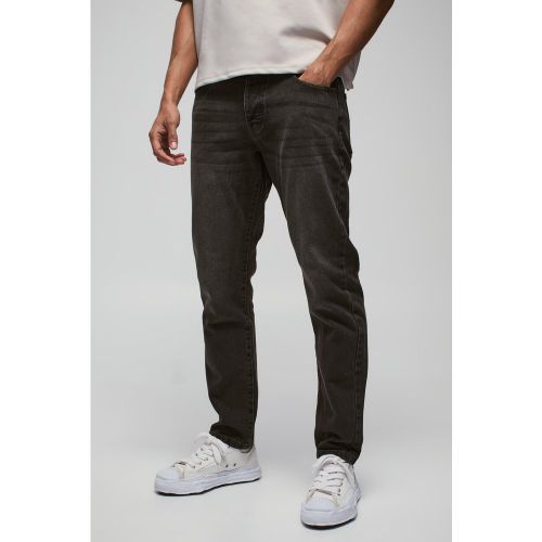 Jeans Slim Fit in denim rigido - boohoo - Modalova