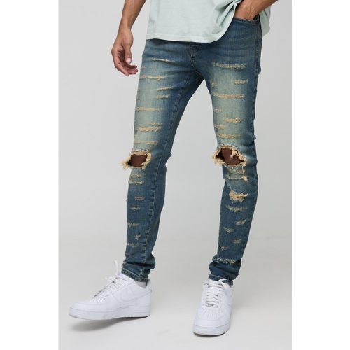 Jeans Skinny Fit con strappi estremi e spacco sul ginocchio - boohoo - Modalova