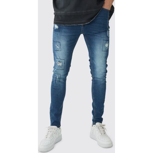 Jeans Skinny Fit Stretch effetto patchwork con strappi & rattoppi - boohoo - Modalova