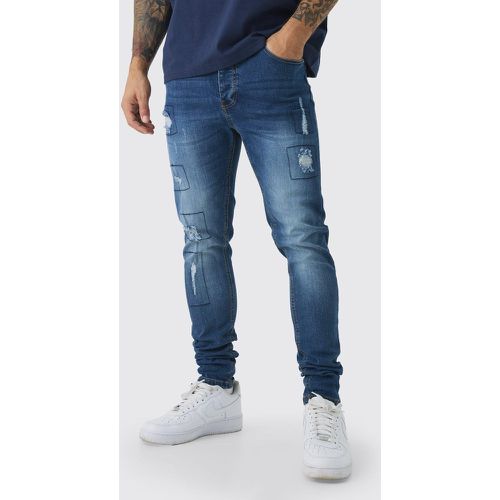 Jeans Skinny Fit Stretch effetto patchwork con strappi & rattoppi - boohoo - Modalova