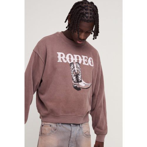 Felpa squadrata oversize slavata con grafica di rodeo - boohoo - Modalova