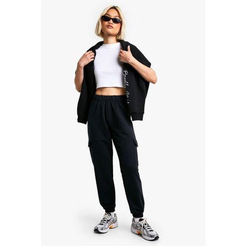 Pantaloni tuta Petite con tasche Cargo - boohoo - Modalova