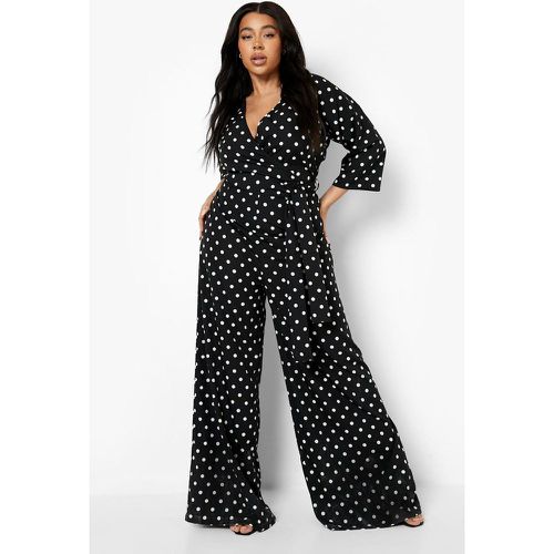 Tuta intera scaldacuore Plus Size a pois con laccetti in vita - boohoo - Modalova