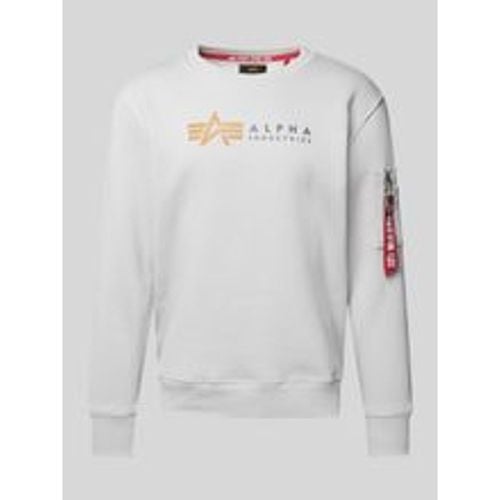 Sweatshirt mit Label-Print und Reißverschlusstasche - alpha industries - Modalova