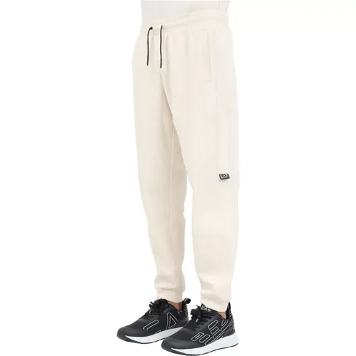 Sportliche beige Hose mit Logo-Print,Joggers mit elastischem Bund und Logo - Emporio Armani EA7 - Modalova