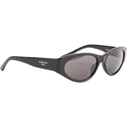 Schwarze ovale Sonnenbrille mit UV-Schutz - Balenciaga - Modalova