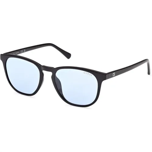 Elegante und Raffinierte Runde Sonnenbrille mit Hellblauen Gläsern - Guess - Modalova