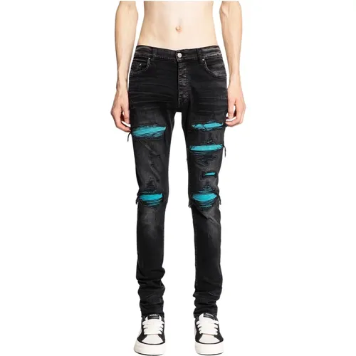 Schwarze Skinny Jeans aus gewaschenem Denim mit Lederpatches - Amiri - Modalova
