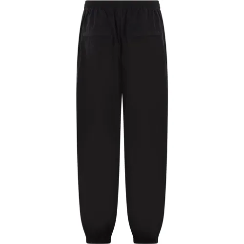 Schwarze Jogginghose mit Puff-Logo-Print,Schwarze Logo Print Hose Elastischer Saum - alexander wang - Modalova