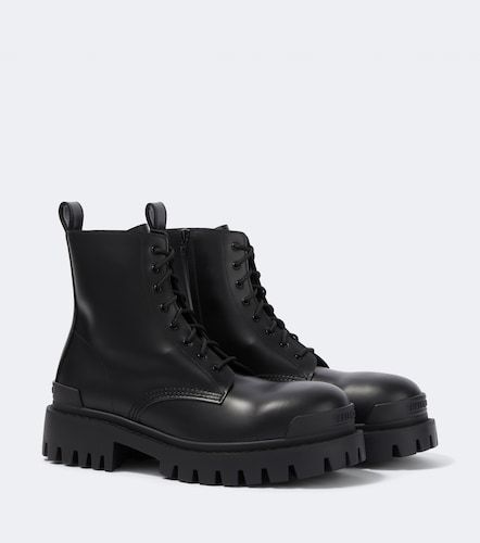 Combat Strike leather combat boots - Balenciaga - Modalova