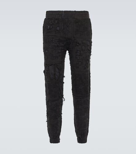 Distressed cotton sweatpants - Givenchy - Modalova