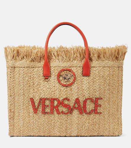 La Medusa leather-trimmed straw tote bag - Versace - Modalova