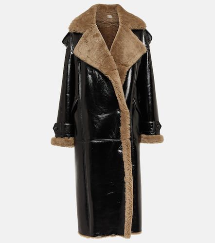 Jordan shearling-trimmed leather coat - The Mannei - Modalova