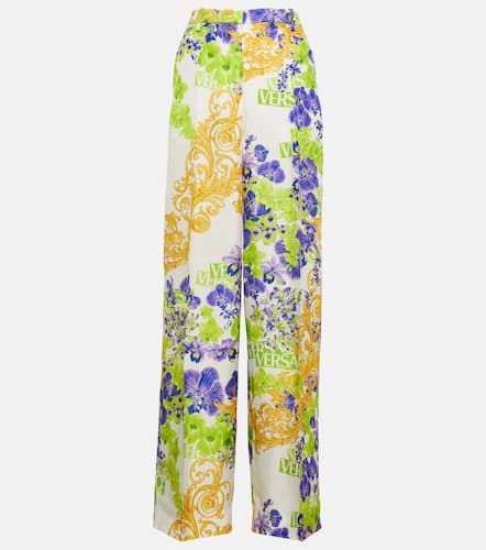 Pantaloni con stampa floreale - Versace - Modalova