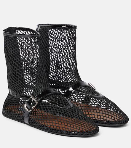 AlaÃ¯a Fishnet leather-trimmed ankle boots - Alaia - Modalova