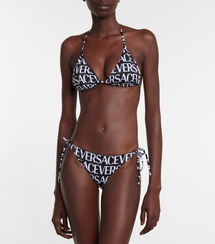 Versace Top bikini con logo - Versace - Modalova
