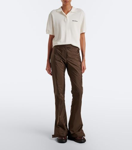 Pantaloni flared in tessuto tecnico - Miu Miu - Modalova