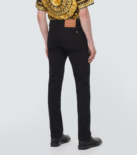 Embellished mid-rise straight jeans - Versace - Modalova