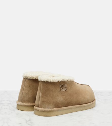 Shearling-lined suede ankle boots - Miu Miu - Modalova