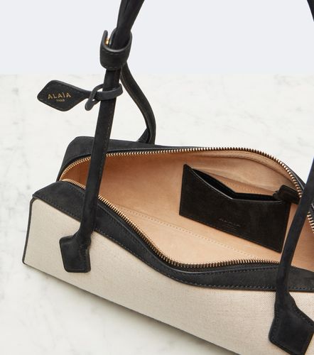 Le Teckel Medium canvas shoulder bag - Alaia - Modalova