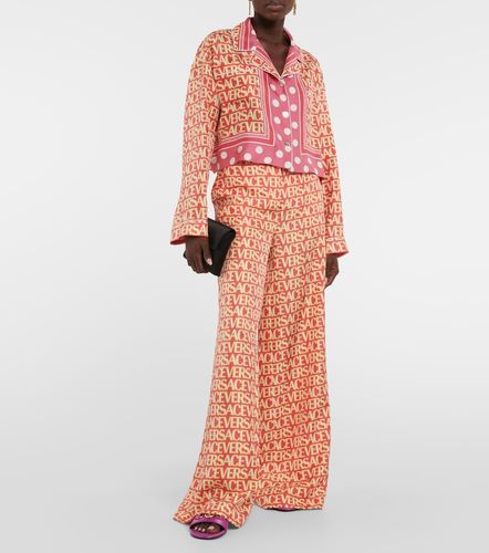 Pantaloni a gamba larga in seta - Versace - Modalova