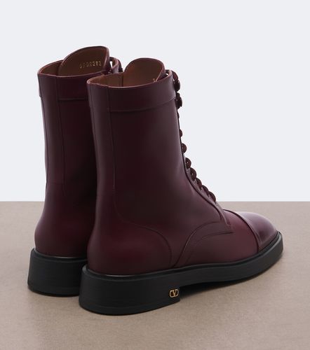 VLogo lace-up leather combat boots - Valentino Garavani - Modalova