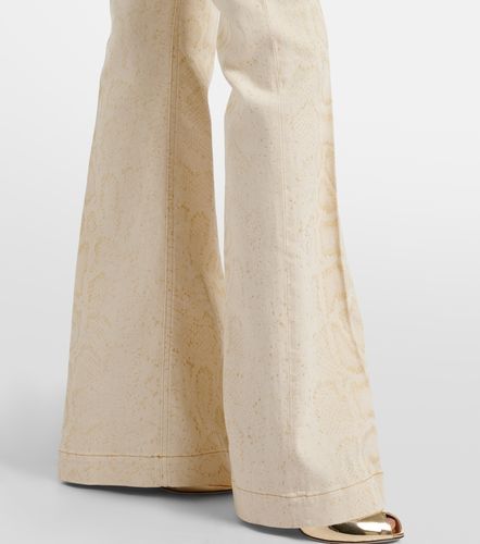 Snake-print flared jeans - Roberto Cavalli - Modalova
