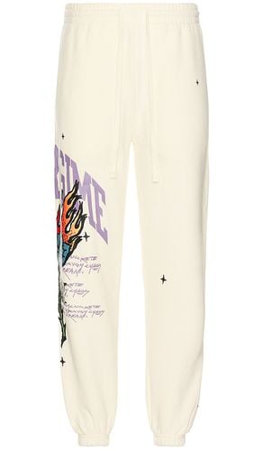 Bloom through this cozy jogger en color crema talla L en - Cream. Talla L (también en XL/1X) - Civil Regime - Modalova