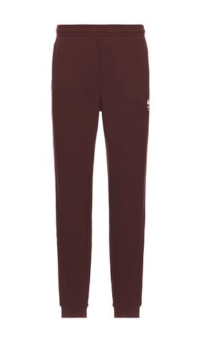 Pantalón deportivo tapered fit en color burgundy talla L en - Burgundy. Talla L (también en M, S, XL/1X) - Lacoste - Modalova