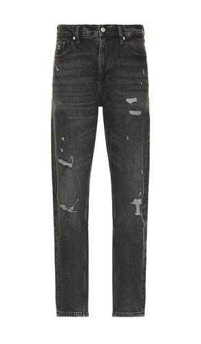 Isaac Relaxed Tapered Jeans in . Size 32, 34, 36 - Tommy Jeans - Modalova