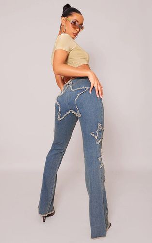 Womens Indigo Vintage Wash Raw Hem Star Embroidery Flared Jeans - - 8 - NastyGal UK (+IE) - Modalova