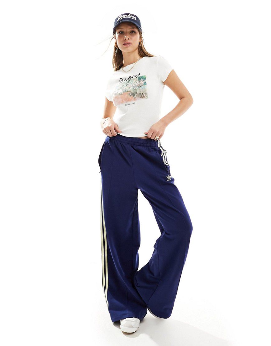 Pantaloni sportivi blu navy e gialli con tre strisce - adidas Originals - Modalova