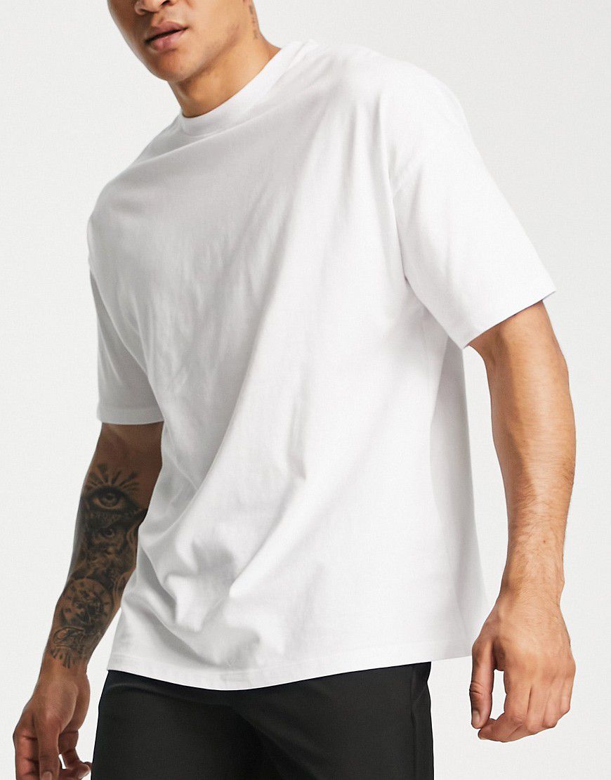 T-shirt per allenamento oversize bianca con icona - ASOS - Modalova