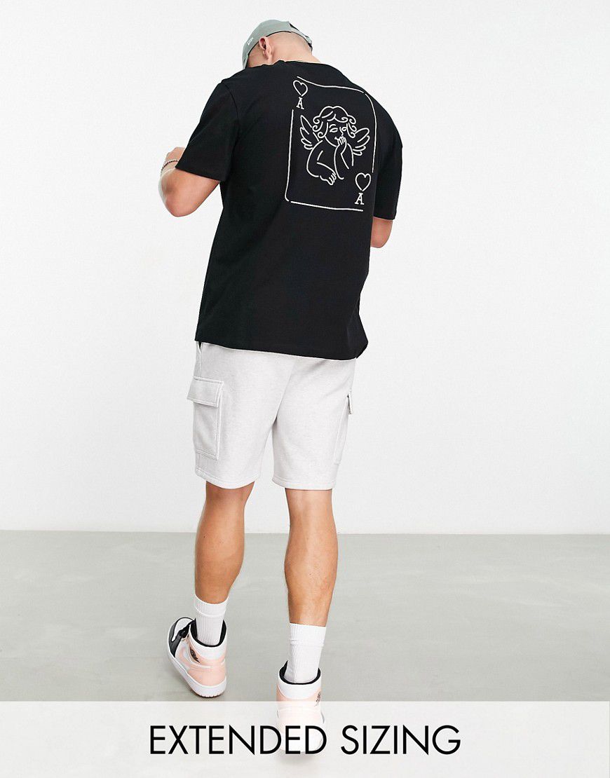 T-shirt comoda nera con stampa di carta da gioco con cherubino sul retro - ASOS DESIGN - Modalova