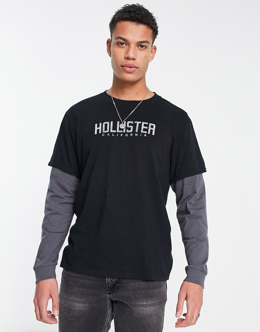 Maglietta a maniche lunghe nera e grigia con logo sul petto - Hollister - Modalova