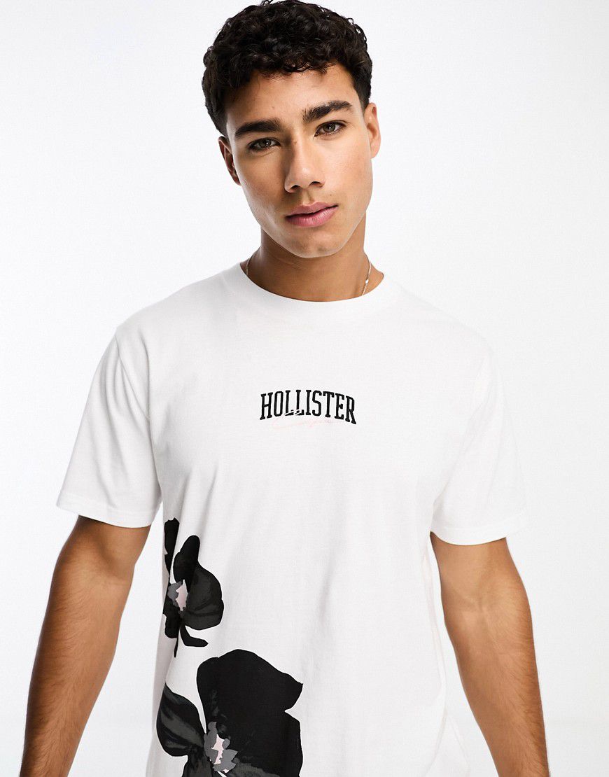 T-shirt bianca con stampa a fiori e logo centrale - Hollister - Modalova